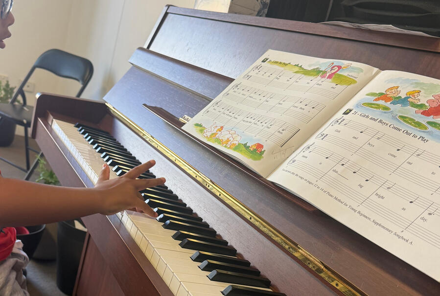 Student learning piano at Major Music Studio